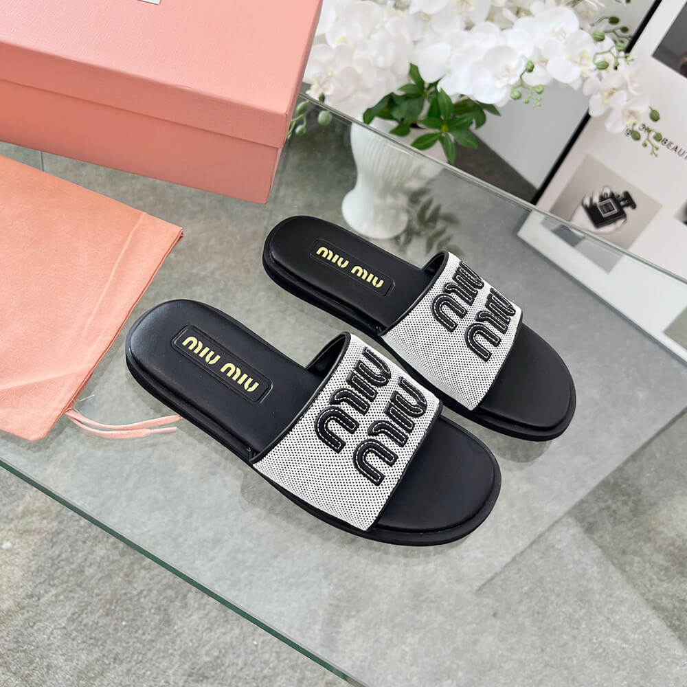 MiuMiu Canvas and leather slides